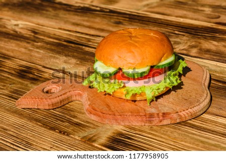 Fresh hamburger on a rustic wooden table