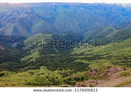 The landscape of the valley from a plateau Bermamyt the North Caucasus at sunrise.