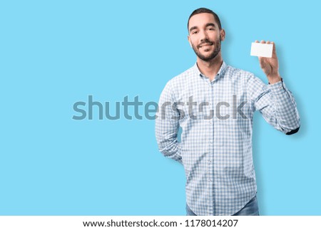 Young man holding a namecard