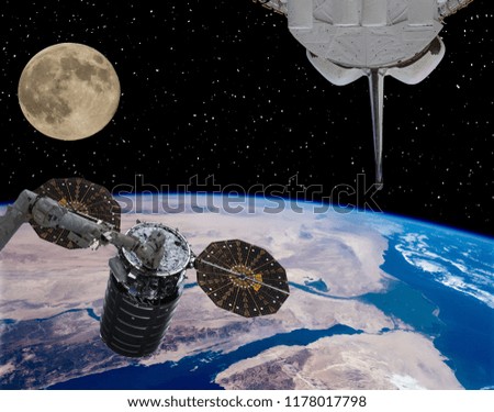 Spaceships and moon. The elements of this image furnished by NASA.
