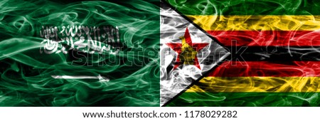 Saudi Arabia vs Zimbabwe smoke flags placed side by side. Thick colored silky smoke flags of Saudi Arabia and Zimbabwe