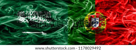 Saudi Arabia vs Portugal smoke flags placed side by side. Thick colored silky smoke flags of Saudi Arabia and Portugal