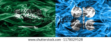 Saudi Arabia vs OPEC smoke flags placed side by side. Thick colored silky smoke flags of Saudi Arabia and OPEC