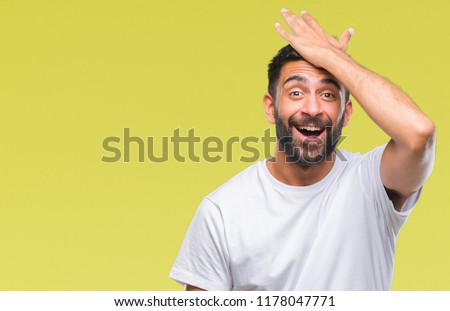 Adult hispanic man over isolated background surprised with hand on head for mistake, remember error. Forgot, bad memory concept. Royalty-Free Stock Photo #1178047771