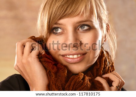 portrait of a beautiful girl on a brown background