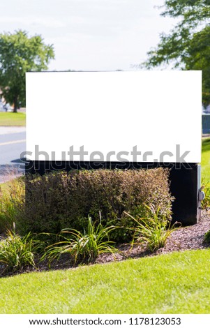 Blank advertisement board with clipping path and copy space in suburban area.