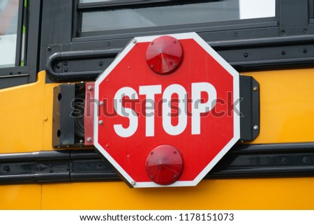 close up on stop sign on the school bus