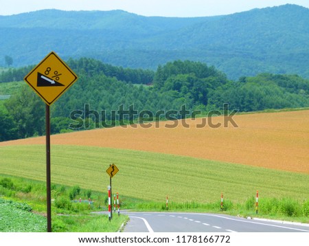 Slope sign warning on highway