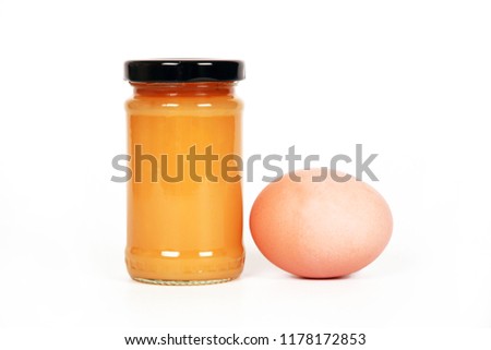 Spread in bottle with egg isolated in white.