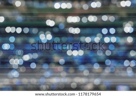 Bokeh background. Blurred colorful light, navy, light, white in soft blue fading tone. Abstract impressive distress dark Background.