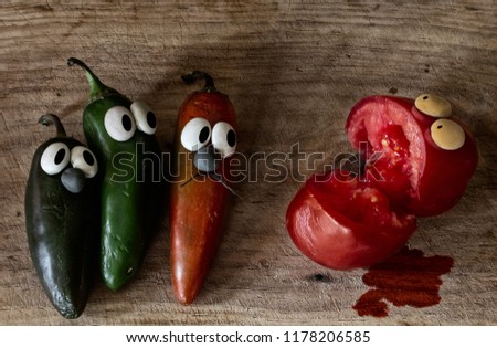 Three chiles suffering in terror because they are about to become Salsa