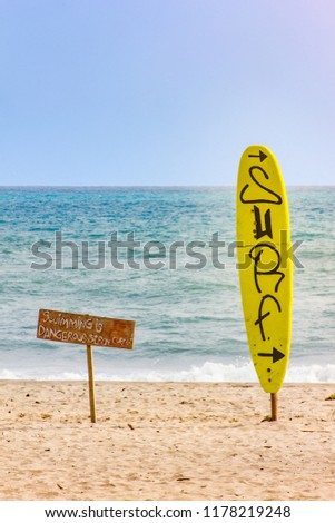 aware sign in a surfer beach called Palomino in colombia
