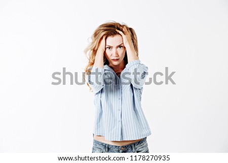Picture of upset frustrated young lady woman writhing in pain, suffering from terrible headache, massaging temples. Brunette girl holding hands on head while having headache after sleepless night
