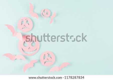 Halloween cartoon mock up for advertising, design, cover - pink paper emoji faces and bats fly on pastel candy mint background.