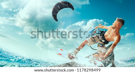Kitesurfing. Man rides on kite on waves Royalty-Free Stock Photo #1178298499