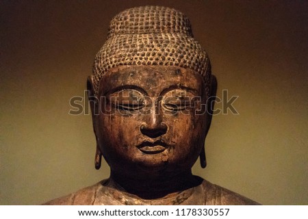 Ancient Japanese Buddah statue isolated close up detail
