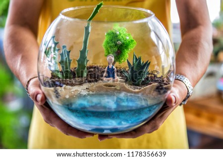 Woman holding terrarium