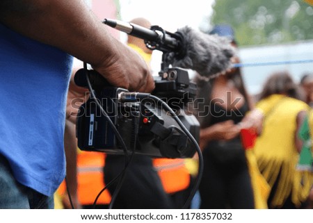 Video camera operator working with his equipment