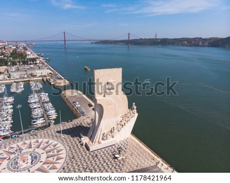 View of Belem district, civil parish of the municipality of Lisbon, Portugal, with Monument to the Discoveries and 25th of April Bridge and Tagus river, drone aerial summer picture