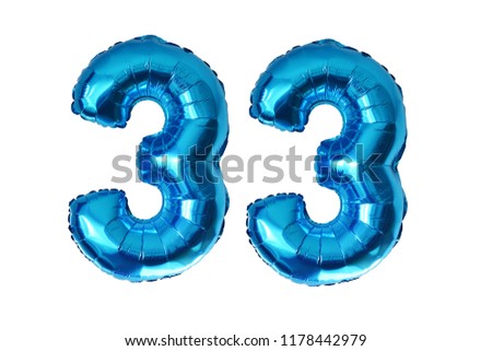 Preparing for 33 years old party with blue shiny inflatable balloons isolated on white background

