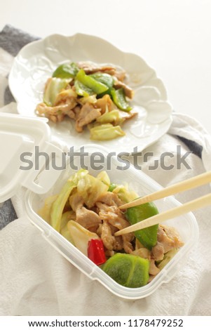 Chinese food, pork and caggage stir fried with chilli pepper in food container