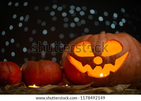 Pumpkin with candles and stars.Helovin