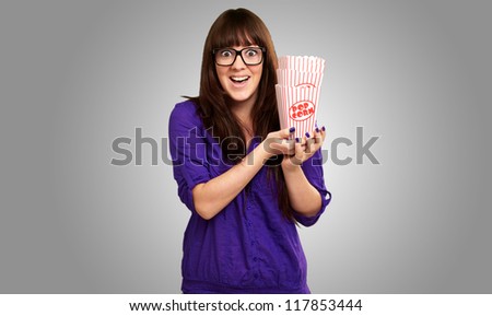 Casual Woman Holding Popcorn Container Isolated On Gray Background