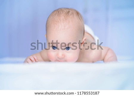 Portrait of a sweet three-month-old baby. Baby care. Healthcare.