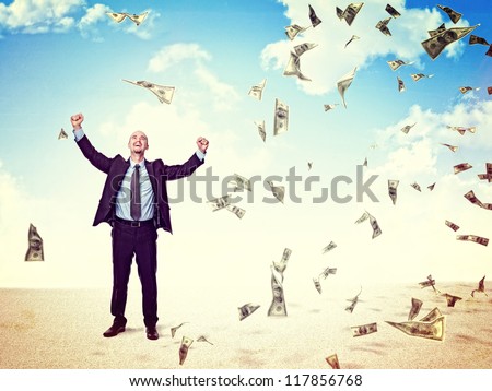happy man and dollar rain from sky