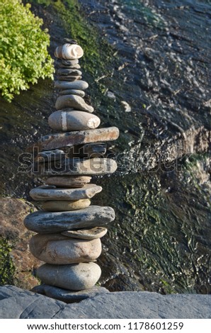 Pile of pebble stones and waterfall. Zen and Harmony themes