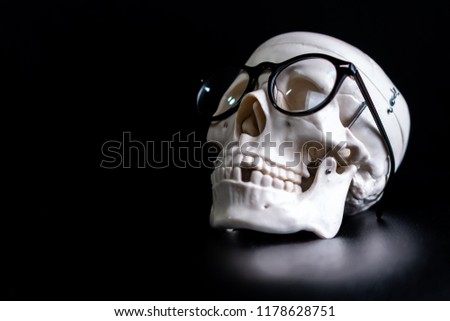 A skull with a spec on