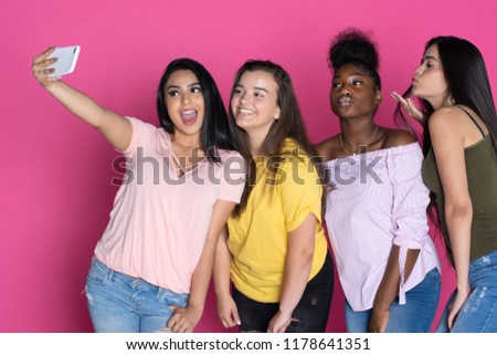 Group of diverse teen together on a pink background