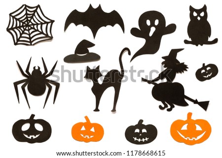 Happy Halloween Set cut out of black orange paper silhouettes pumpkin, witch, ghost, cat, owl, spider, web, hat, bat, castle isolated on white background. Concept Paper cut style. Top view