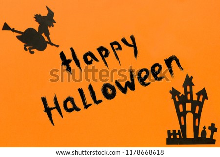 Halloween background. Text Happy Halloween Black paper Witch and haunted house castle and black frame on orange background Concept, Flat lay