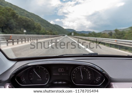 Car dashboard on the highway