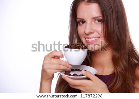 Close up image of beautiful young woman with cup of coffee beans, isolated on white