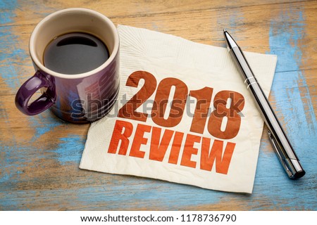 2018 review text on a napkin with a cup of coffee Royalty-Free Stock Photo #1178736790
