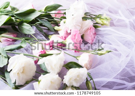 Romance day. Lisianthus, eustoma flowers with veil