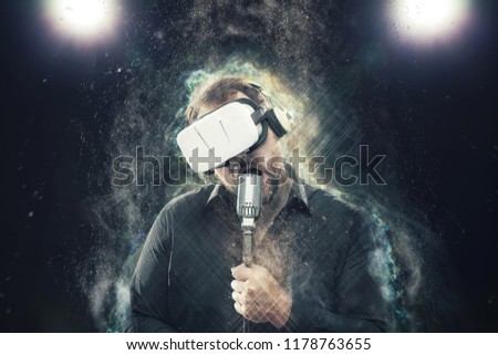 Businessman wearing virtual reality glasses and singing