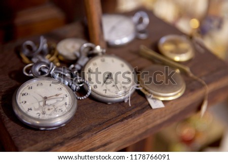Vintage Antique pocket watch on wooden floor