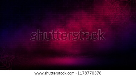 Background of an empty room with a brick wall, cracks, searchlight lights, neon light.