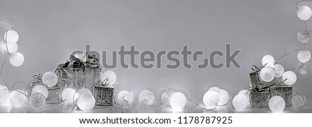 Christmas decorations. Round electric Christmas lights with some decor elements. Horizontal banner.