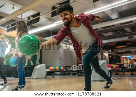 Shot of a young african american man throwing the bowling ball