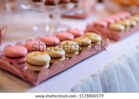 Pink and yellow macaroons on the candy bar