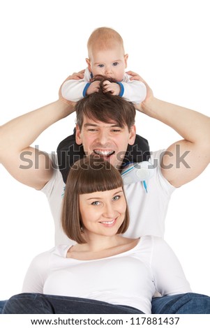 bright picture of baby boy sitting on daddy neck with mom isolated over white background