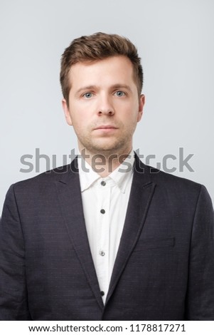 Photo for document or passport id. Mature caucasian man in suit and white shirt.