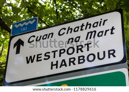 A road sign showing the direction to Westport Harbour in County Mayo, Ireland.
