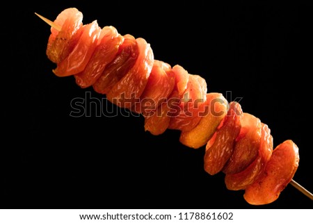 Dry apricot against black background
