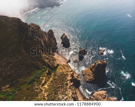 Beautiful aerial vibrant view of Capo Da Roca, the most western point of Europe, Portuguese municipality of Sintra, near Azoia, district of Lisbon, Serra de Sintra, Portugal, shot from drone