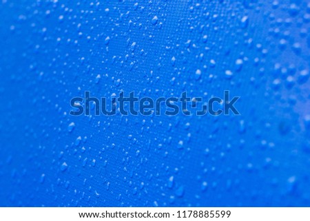 Rain drops on a blue background.
